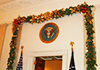 The presidential seal outside the Entrance Hall is wrapped in greenery and columns